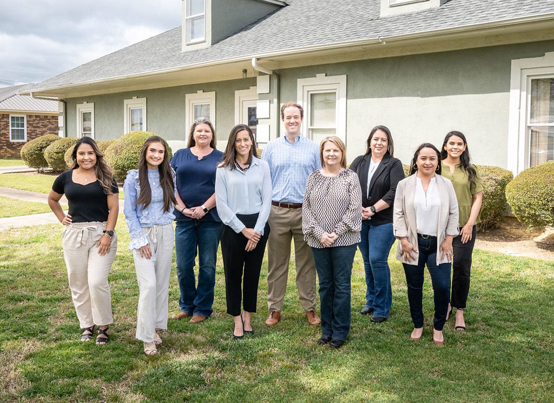 About Our Agency - Allison Insurance Team Portrait Outside of the Office on a Sunny Day